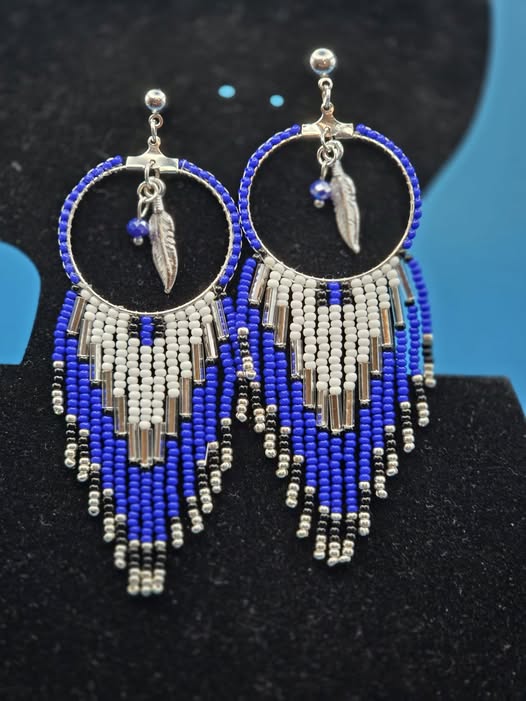 Blue, white, silver, and black handmade hoop fringe earrings with feather charms