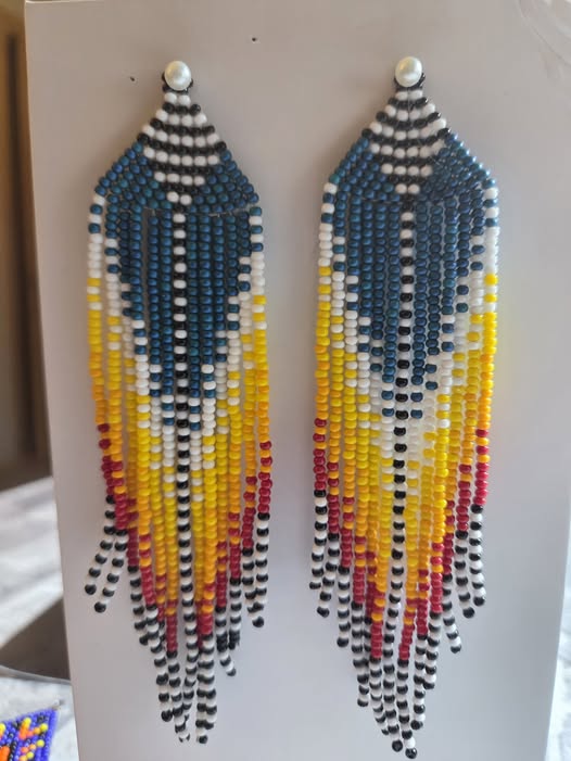 Blue, yellow, white, black, and red handmade beaded fringe earrings