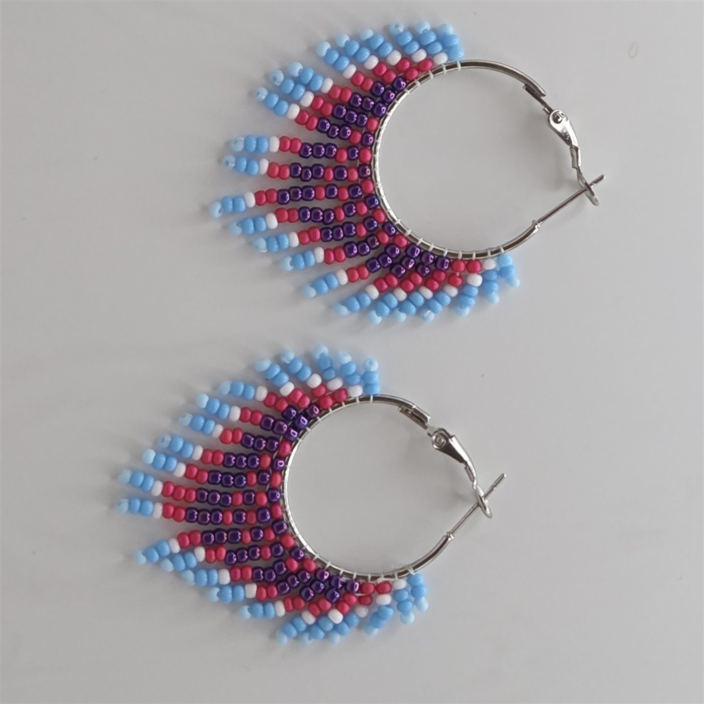 Red, blue, white, and silver handmade beaded hoop earrings